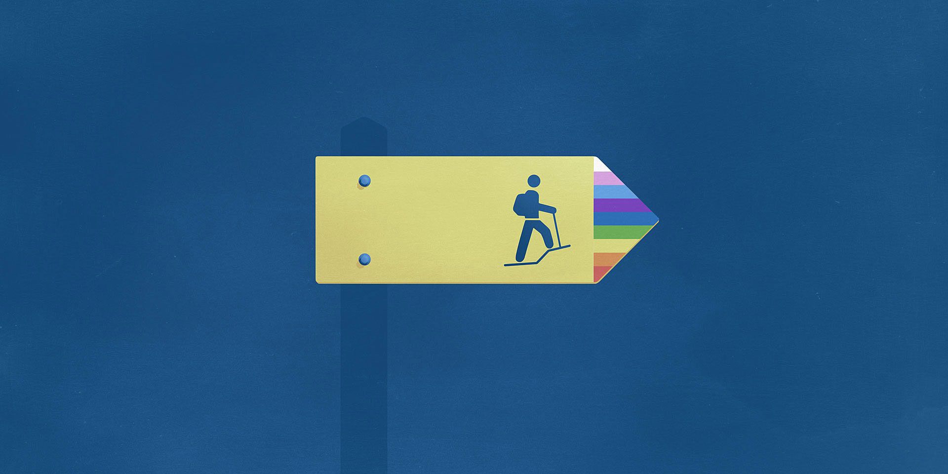 Un panneau de signalisation de chemin de randonnée suisse indique la direction à suivre. L'extrémité de la flèche est colorée aux couleurs de l'arc-en-ciel. Ce panneau symbolise le chemin vers l'égalité des personnes LGBTI.